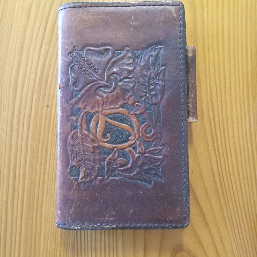 Hand made Vintage Embossed Leather address/note book. Measures 4x6 1/2"